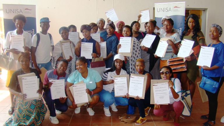 Community participants showcasing their certificates of attendance